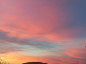 Low angle view of dramatic sky during sunset