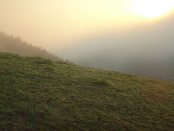 Scenic view of landscape against sky during sunset