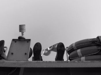 Low angle view of lighting equipment against sky