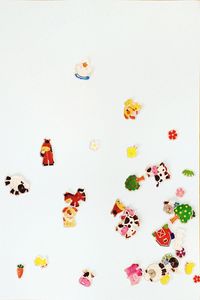 High angle view of multi colored pencils on white background