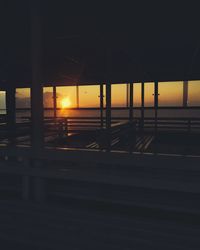 Silhouette built structure against sky during sunset