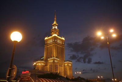 Palace of culture and science against sky at night