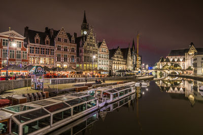 Illuminated buildings in city at night