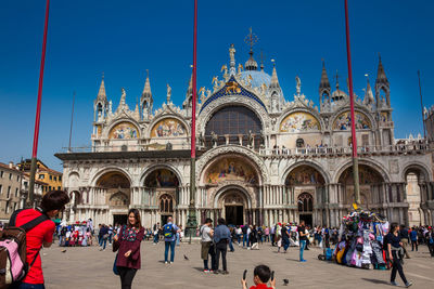 Tourists at the famous saint mark square of venice in a beautiful sunny early spring day