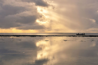 Scenic view of sea against sky at sunset