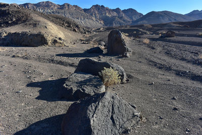 Shadow of person on desert against sky