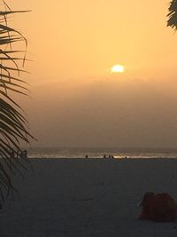 Scenic view of sea against clear sky at sunset
