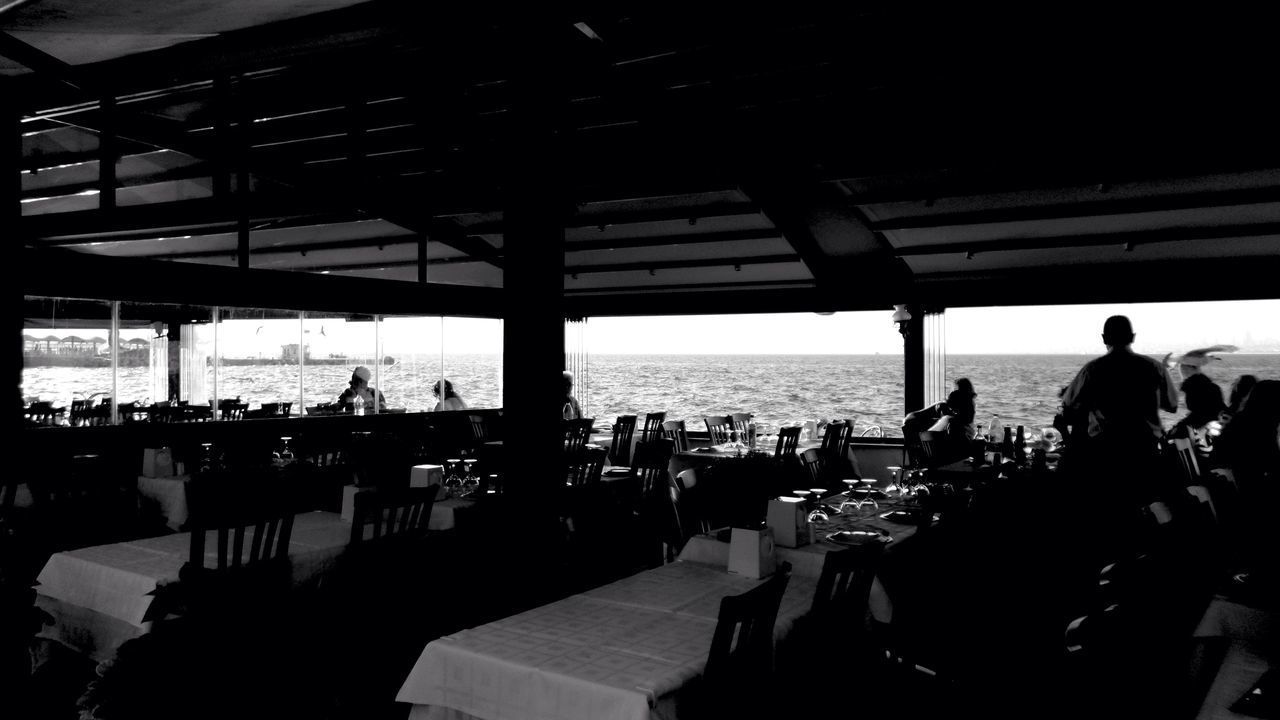 PEOPLE SITTING AT RESTAURANT