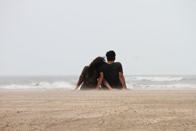 Rear view of a couple on a beach