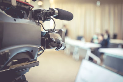 The cameraman setting up the camera for the upcoming conference