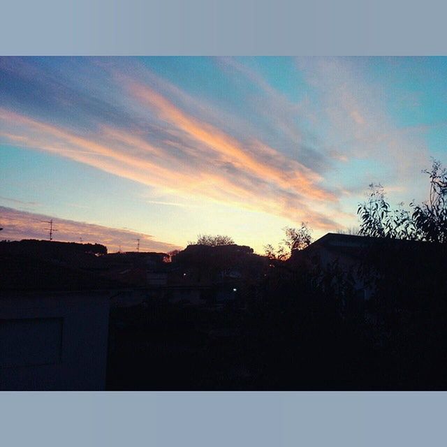 sunset, architecture, building exterior, built structure, silhouette, sky, house, cloud - sky, residential structure, cloud, tree, residential building, low angle view, orange color, outdoors, dusk, no people, nature, beauty in nature, building