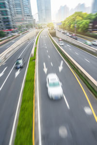 Blurred motion of vehicles on road in city