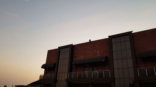 Low angle view of building against sky at dusk