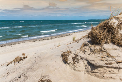 Scenic view of beach against sky