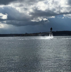 Scenic view of sea against cloudy sky