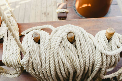 Close-up of rope tied on wood