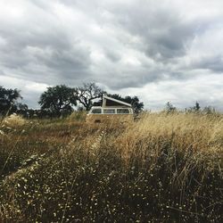 Built structure on field against sky