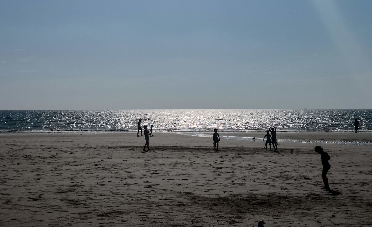 GROUP OF PEOPLE ON BEACH