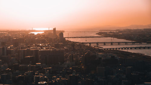 High angle view of city buildings during sunset