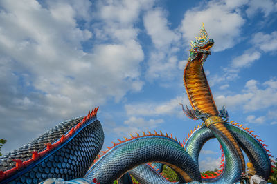 Low angle view of statue against sky