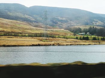 Scenic view of lake against mountain range