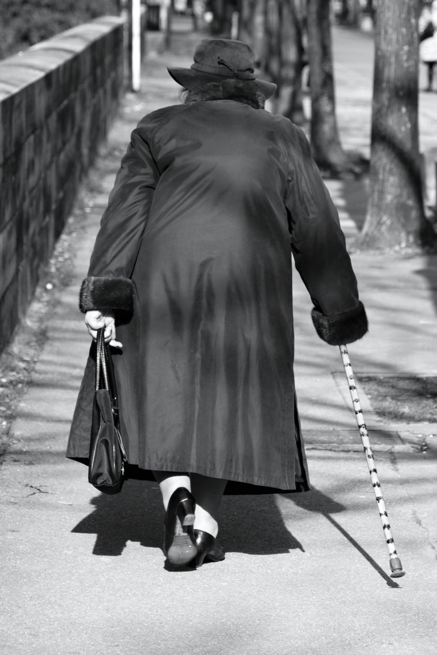 full length, lifestyles, rear view, leisure activity, childhood, casual clothing, focus on foreground, boys, men, elementary age, playing, girls, street, park - man made space, day, walking, sitting