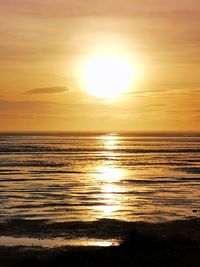 Scenic view of sea against romantic sky at sunset