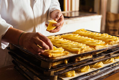 Midsection of man preparing food