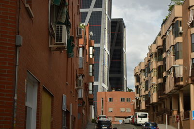 Low angle view of buildings in city against sky