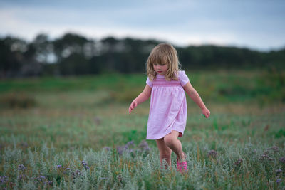Full length of a girl on field
