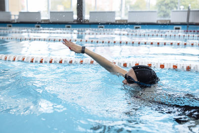 Young woman swimming in pool