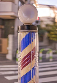 Hairstylist barber retro pole with a red color for blood and a blue color for veins in japan.