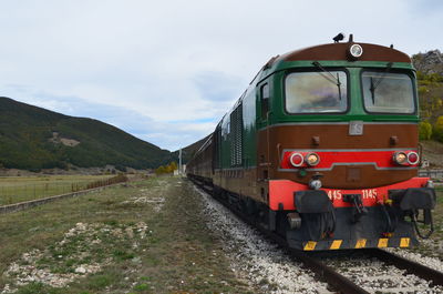 Train on railroad track against sky