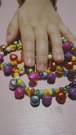 Close-up of hand holding multi colored lights
