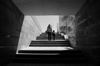 Low angle view of mother and daughter on steps