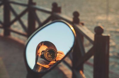 High angle view of man photographing through railing