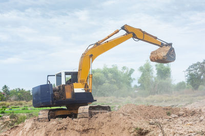 Construction site on field against sky