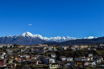 Scenic view of mountain range against cloudy sky