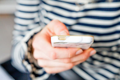Close-up of man using mobile phone