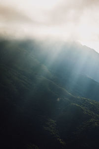 High angle view of sunlight streaming through clouds