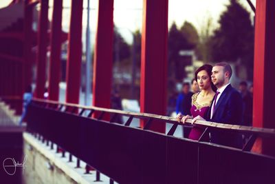 Close-up of woman standing on bench