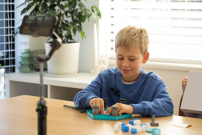 Boy playing with toy at home