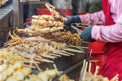 Midsection of man preparing food