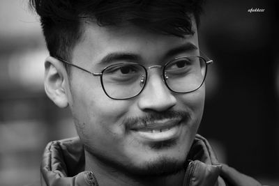 Close-up portrait of smiling young man