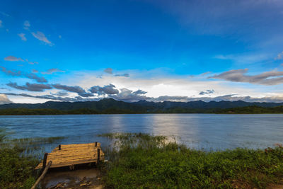 Scenic view of lake against blue sky