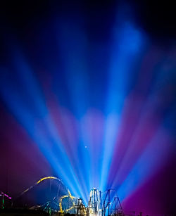 Low angle view of illuminated ferris wheel at night