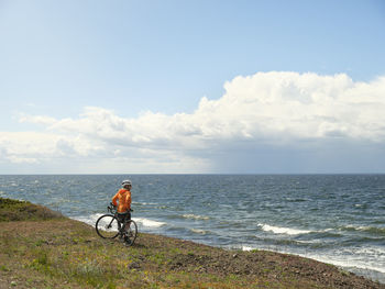 Cyclist looking at sea