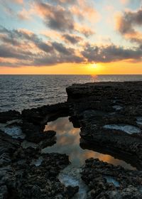 Scenic view of sea against sky during sunset