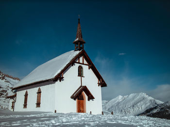 View of snow covered building against sky