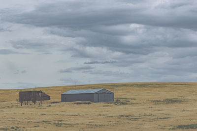 House on field against sky